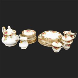 Royal Albert Country Roses tea and dinner service for six place settings, comprising teapot, milk jug, cups and saucers, dessert plates, side plates and dinner plates, all with printed mark beneath 