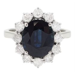 18ct white gold oval cut sapphire and round brilliant cut diamond cluster ring, stamped 750, sapphire approx 3.85 carat, total diamond weight approx 0.80 carat