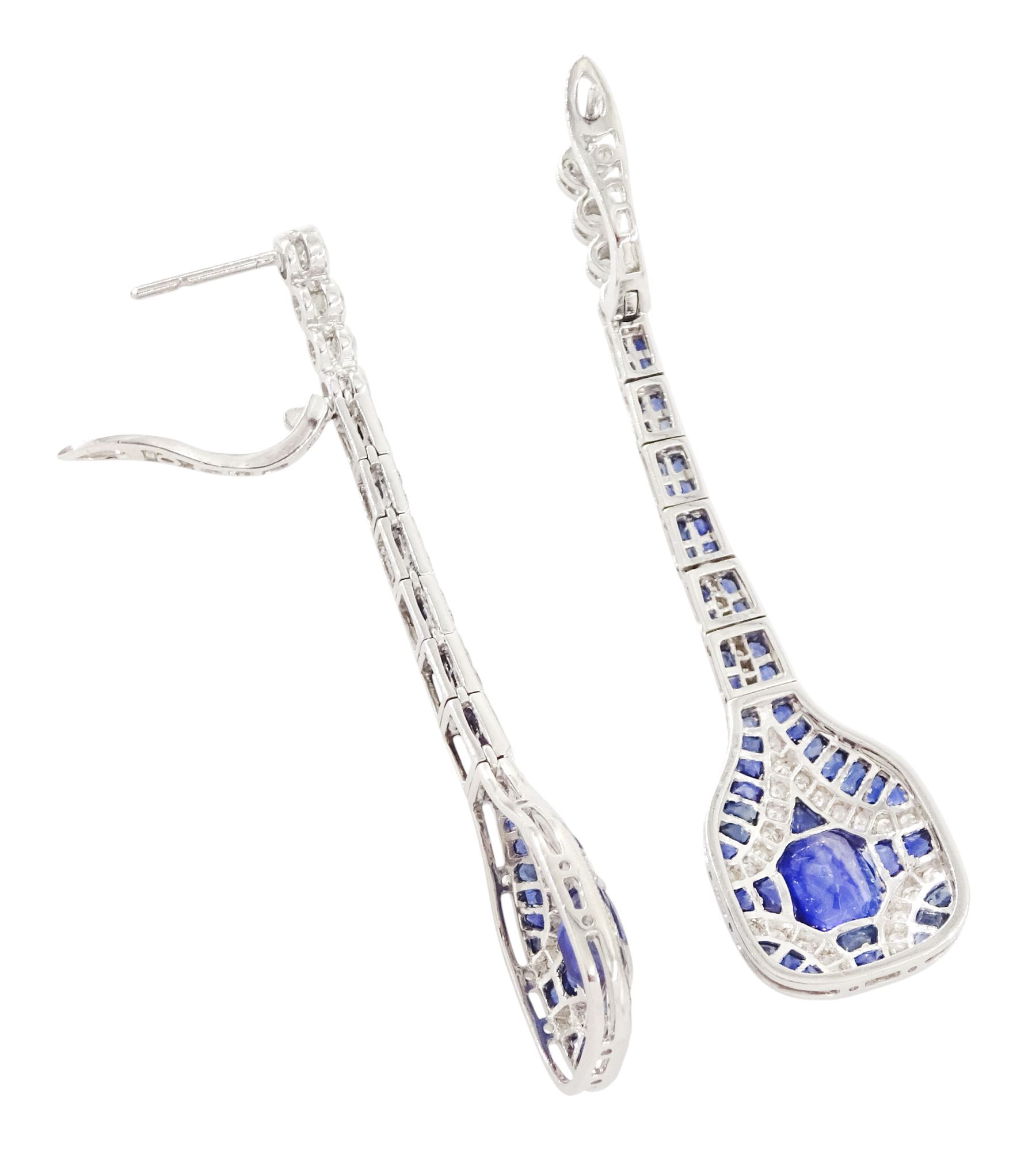 Pair of platinum sapphire and diamond pendant earrings, each stud milgrain set with a single oval cut sapphire, surrounded by calibre cut sapphires and single cut diamonds, suspending from six graduating articulated panels, to four single cut diamonds, total sapphire weight approx 3.80 carat, total diamond weight approx 0.80 carat