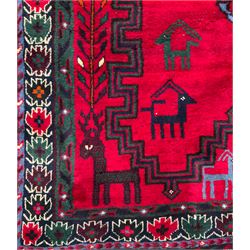 Northwestern Persian Cirjan hand-knotted carpet, madder red field with three linked stepped lozenge medallions in blue, ivory and green, flanked by angular motifs within a dark green border of serrated leaves and rosettes 