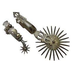 Single South American gaucho steel spur with large 15cm diameter twenty-four spike heel rowel L30cm; and another similar smaller steel spur with silver mounts (2)