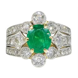 18ct gold oval emerald and milgrain set diamond cluster ring, with three row split diamond set shoulders