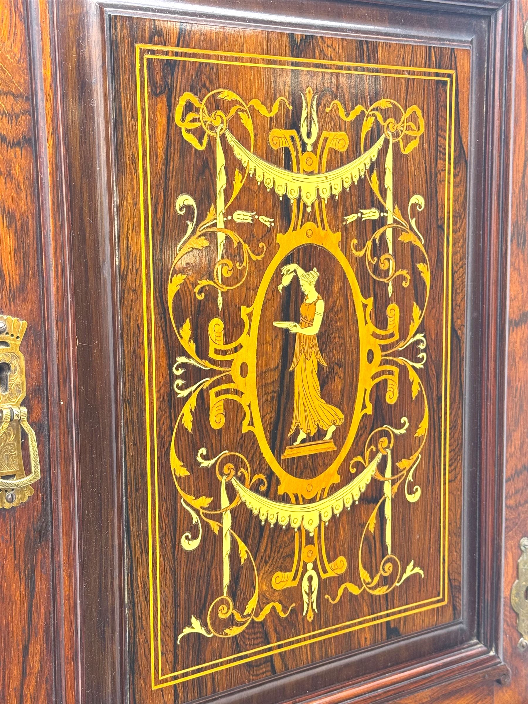 Late 19th century inlaid rosewood free standing corner display cabinet, the upper section featuring a mirrored panel above an inlaid cupboard with a felt-lined interior, complemented by a recessed open compartment with a mirrored back, the base with a glazed door enclosing two felt-lined shelves, on turned supports