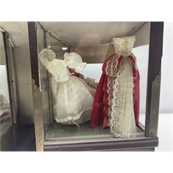 Early 20th century scratch-built wooden hat & gown shop diorama 'Joan', of double-fronted form glazed on three sides with brass and aluminium mounts, rear access apertures and storage under L63cm H45cm D31cm; with small collection of dresses and hats on display stands