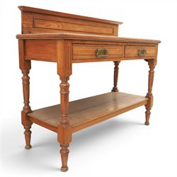 Edwardian oak serving table, raised panelled back over moulded rectangular top, fitted with two frieze drawers with brass drop handles, fluted front uprights, on turned supports united by potboard undertier