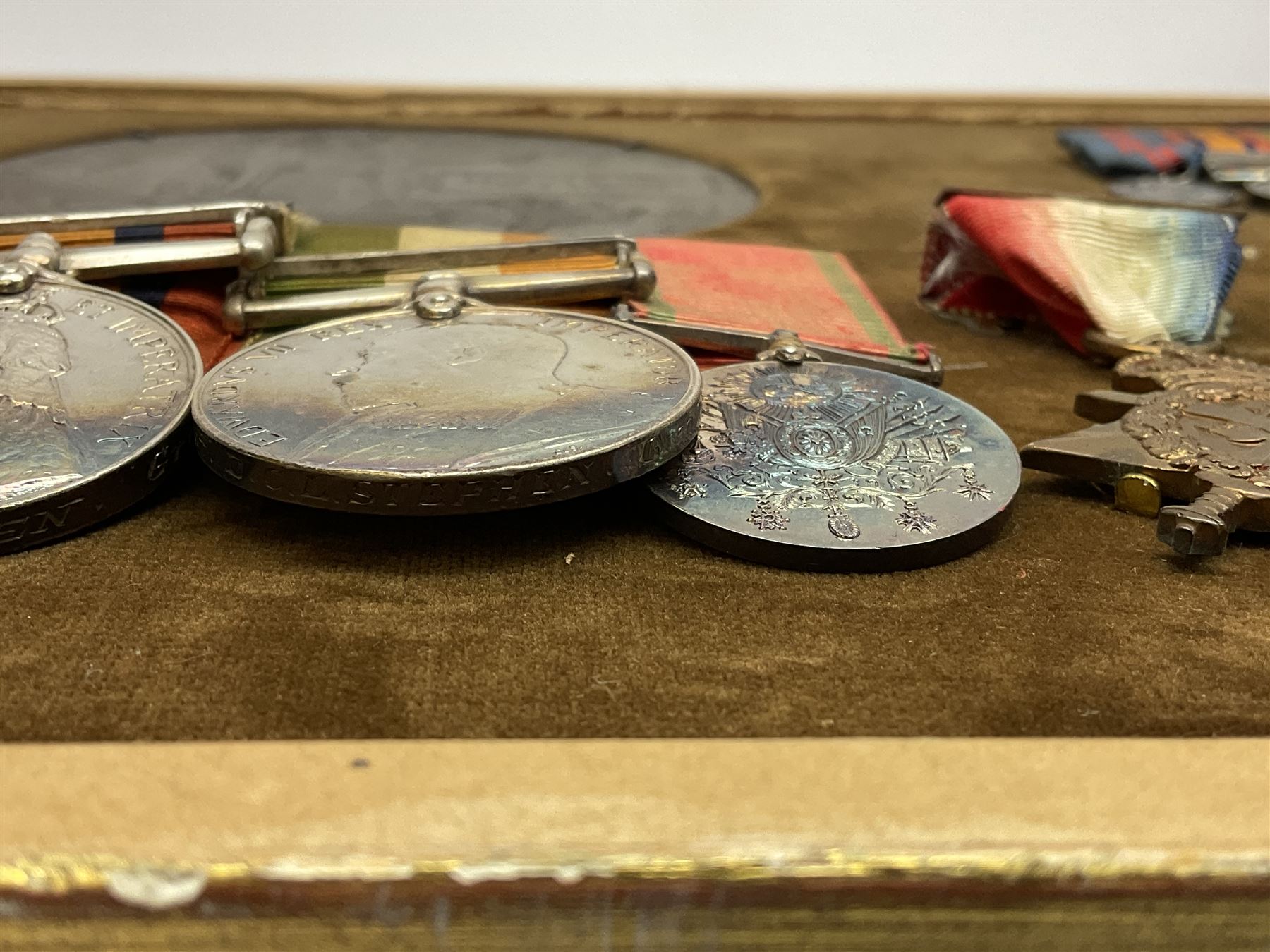 DOW Eure-et-Loir group of seven Boer War/WW1 medals comprising Queens South Africa Medal with three clasps for Cape Colony, Transvaal and Wittebergen, Kings South Africa Medal with two clasps for South Africa 1901 and South Africa 1902, Turkish Liakat Medal, George V Coronation Medal, 1914 Star with 5th Aug.-22nd Nov. 1914 bar, British War Medal and Victory Medal awarded to Captain Douglas Leslie Stephen Grenadier Guards; group of four Boer War and 1911 Coronation miniature medals; all with ribbons and later mounted and framed with his bronze memorial plaque;  together with Cecil Cutler (active 1886-1934) heightened watercolour three-quarter length portrait of Douglas in uniform, signed and dated 1915, 52 x 35cm; gilt frame; Auctioneers Note: Douglas was the elder brother of Albert Alexander Leslie Stephen (see previous lot) and died of wounds on 10th September 1914 in France.