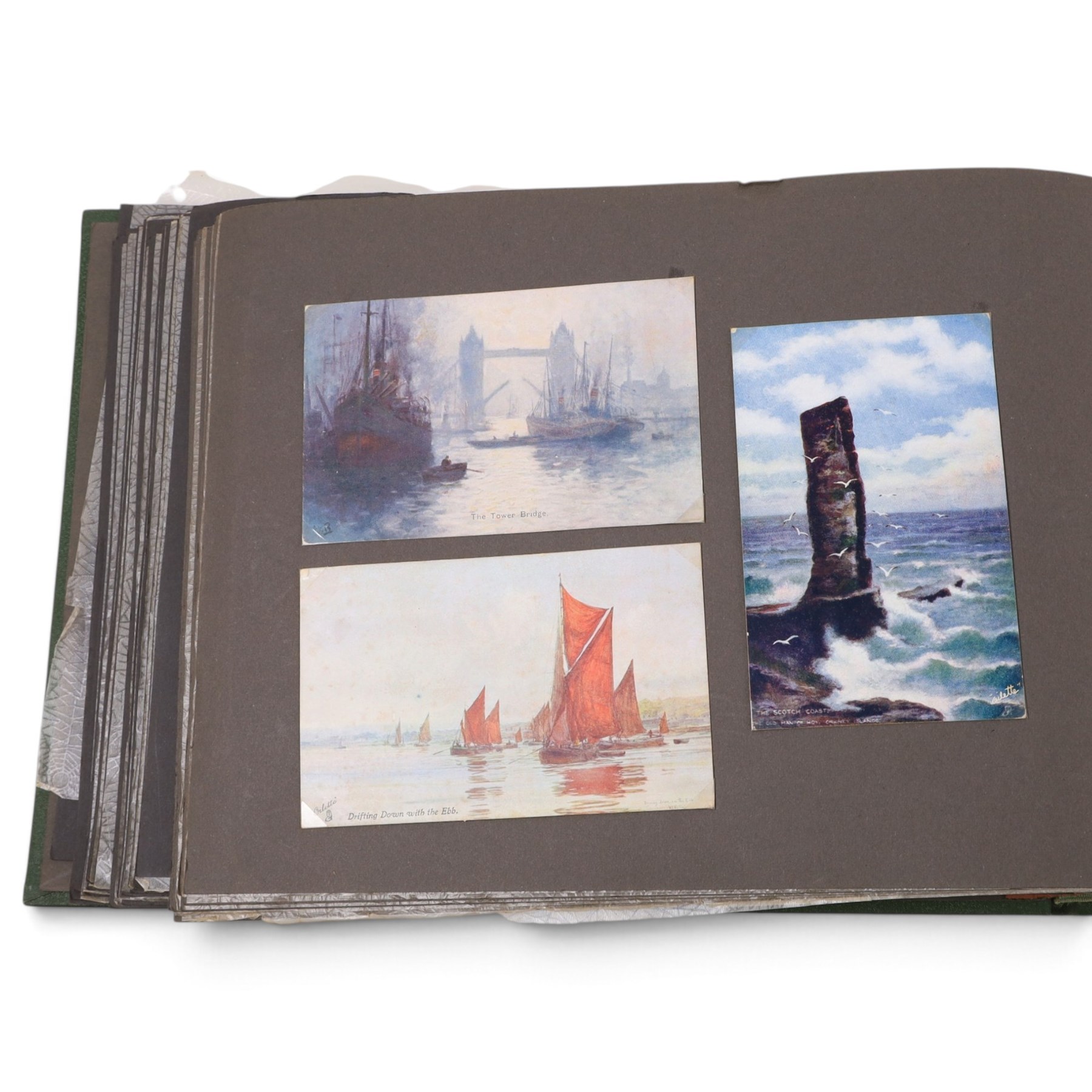 Two early to mid 20th century postcard albums, containing black and white and colour postcards, the first labelled Meine Reisen in Indien containing postcards of Arabia, India, Egypt, some personal photographs and newspaper clippings, of postcards, the second labelled Meine Reisen in England, containing mostly postcards of London, some greetings cards etc
