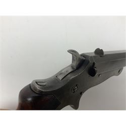 19th century .297/230 rimfire single shot break-action pistol, ''Tranter's Patent'', no.2;  the 25cm octagonal barrel marked Kynoch Gun Factory Aston; fin fore-sight, dove-tail standing notch rear-sight, open iron frame with barrel release button to the integral fore-end, central hammer, spur trigger and chequered walnut one-piece grip with domed iron pommel-cap L36cm overall