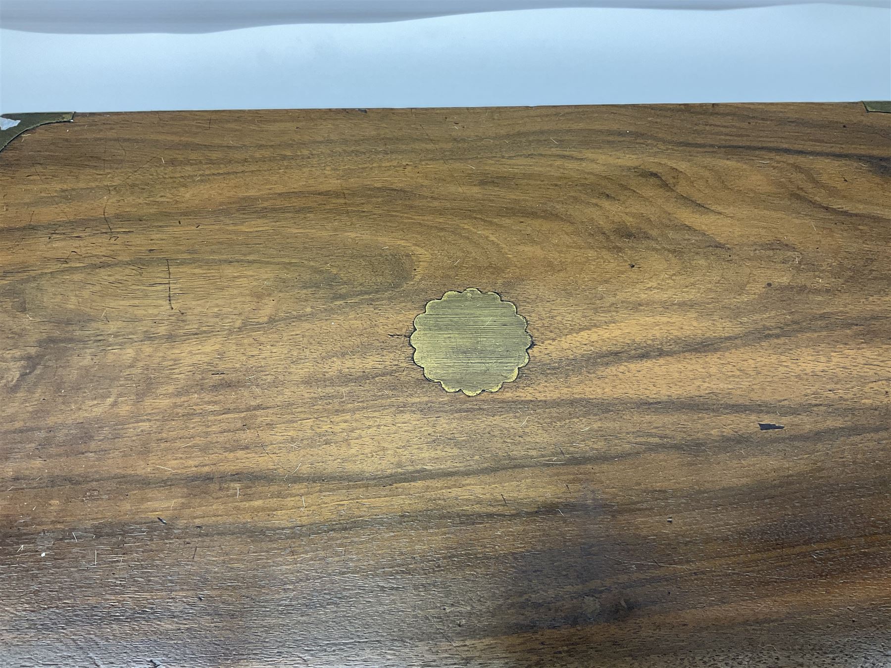 19th century burr yew wood tea caddy, of sarcophagus form, with strung details and brass mounts, the interior split into three compartments, upon four brass bun feet, together with an oak and brass bound writing slope, with red leather interior with gilt detailing, largest H16cm, W40cm