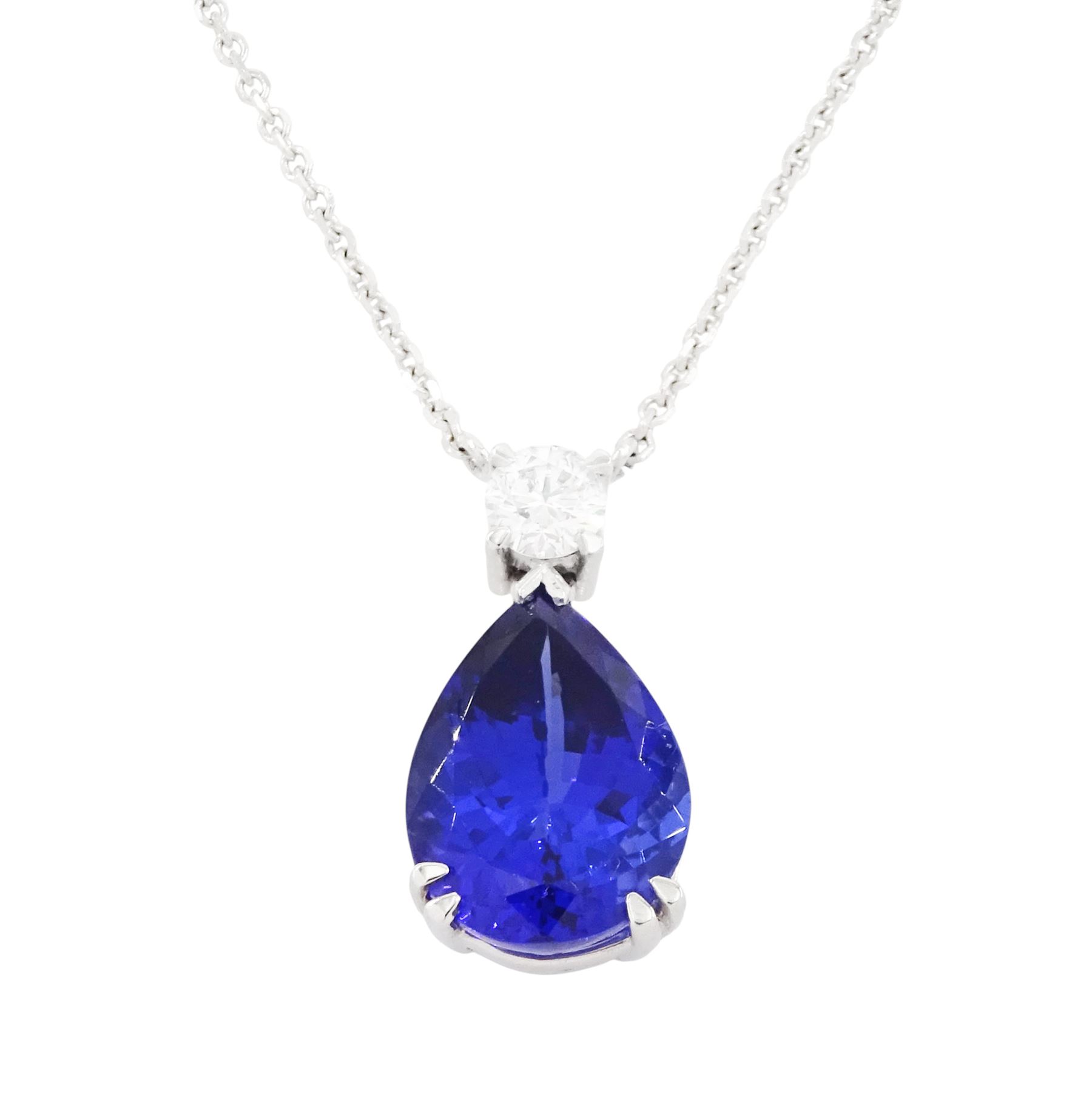 18ct white gold tanzanite and diamond necklace, single pear cut tanzanite of approx 7.60 carat, suspending from a single round brilliant cut diamond of approx 0.45 carat, to a fine belcher link chain necklace, hallmarked