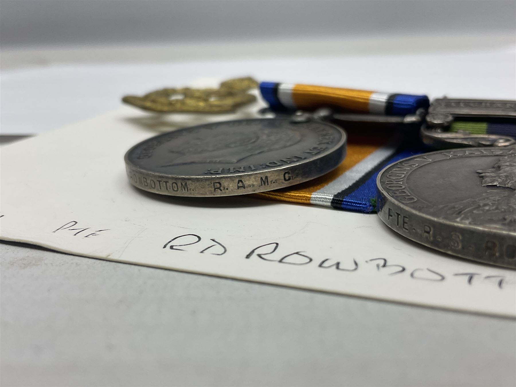 George V India General Service Medal with Afghanistan N.W.F. 1919 clasp and WW1 British War Medal awarded to 79561 Pte. R.D. Rowbottom R.A.M.C.; both with ribbons; card mounted with cap badge and Medical Corps cloth badge