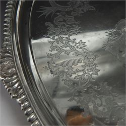 Victorian silver twin handled tray, of oval form, engraved with floral and foliate swags with vacant cartouche to centre, with oblique gadrooned rim, palmette details and foliate decoration to handles, hallmarked Atkin Brothers, Sheffield 1901, handle to handle W70cm