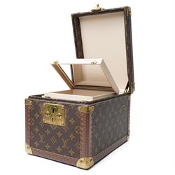 Late-20th century Louis Vuitton monogram Boîte Flacons vanity coffret, monogram canvas with lozine trim and brass mounts, single front brass lock stamped Louis Vuitton with key code 1247413, the interior fitted with leather flacon retaining loops and lift-out lidded tray with leather handle, label to interior printed Louis Vuitton Paris serial number 1045768, together with two keys stamped with matching serial numbers to the lock and luggage tag, circa late 1990s-early 2000s