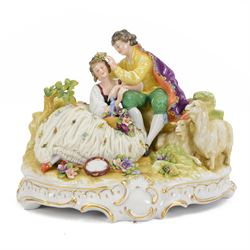 German lace figure group, modelled as a courting couple upon a naturalistically modelled b...
