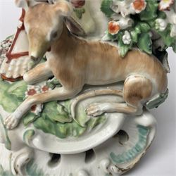18th century Derby figure of Diana the huntress, circa 1760, modelled reaching for an arrow from quiver across her back, with recumbent hound at her feet, upon a scrolled base with bocage detail, H27.5cm