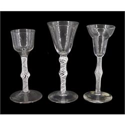 18th century drinking glass, the ogee bowl upon a single series opaque twist knopped stem and conical foot, H15.5cm, together with two late 18th/early 19th century drinking glasses, the first example with pan-top bowl upon a single series air twist knopped stem, the second example with funnel bowl upon a single series opaque twist double knopped stem, each with conical foot and ground pontil