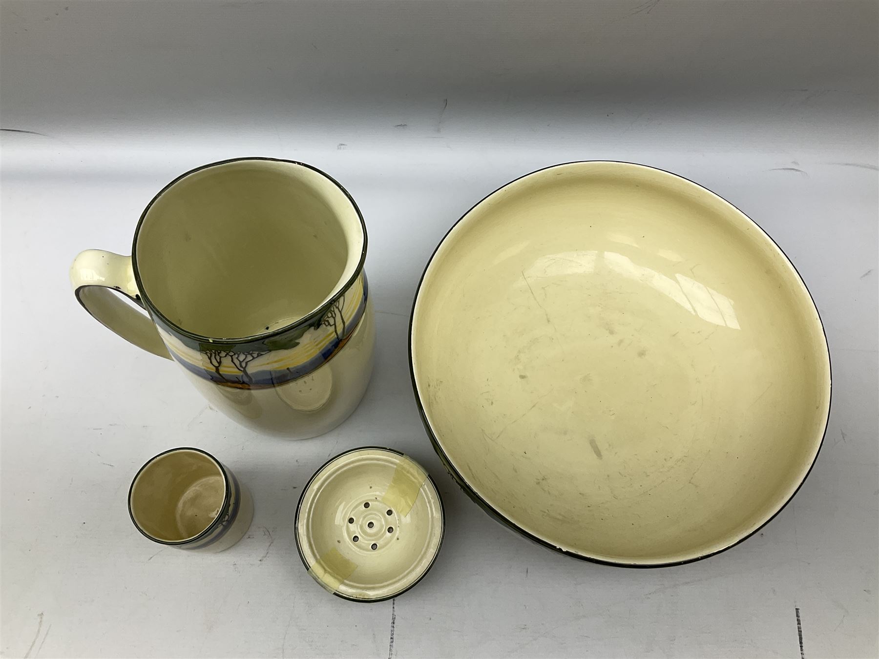 1930's Art Deco Royal Doulton ceramics decorated with stylised trees, comprising washbowl and jug, soap dish and vase