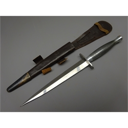  2nd Variant Pattern Commando Knife, 17.5cm twin edged blade, steel cross guard stamped S below Crows foot, and nickel plated brass chequered grip,  L30cm, leather scabbard   