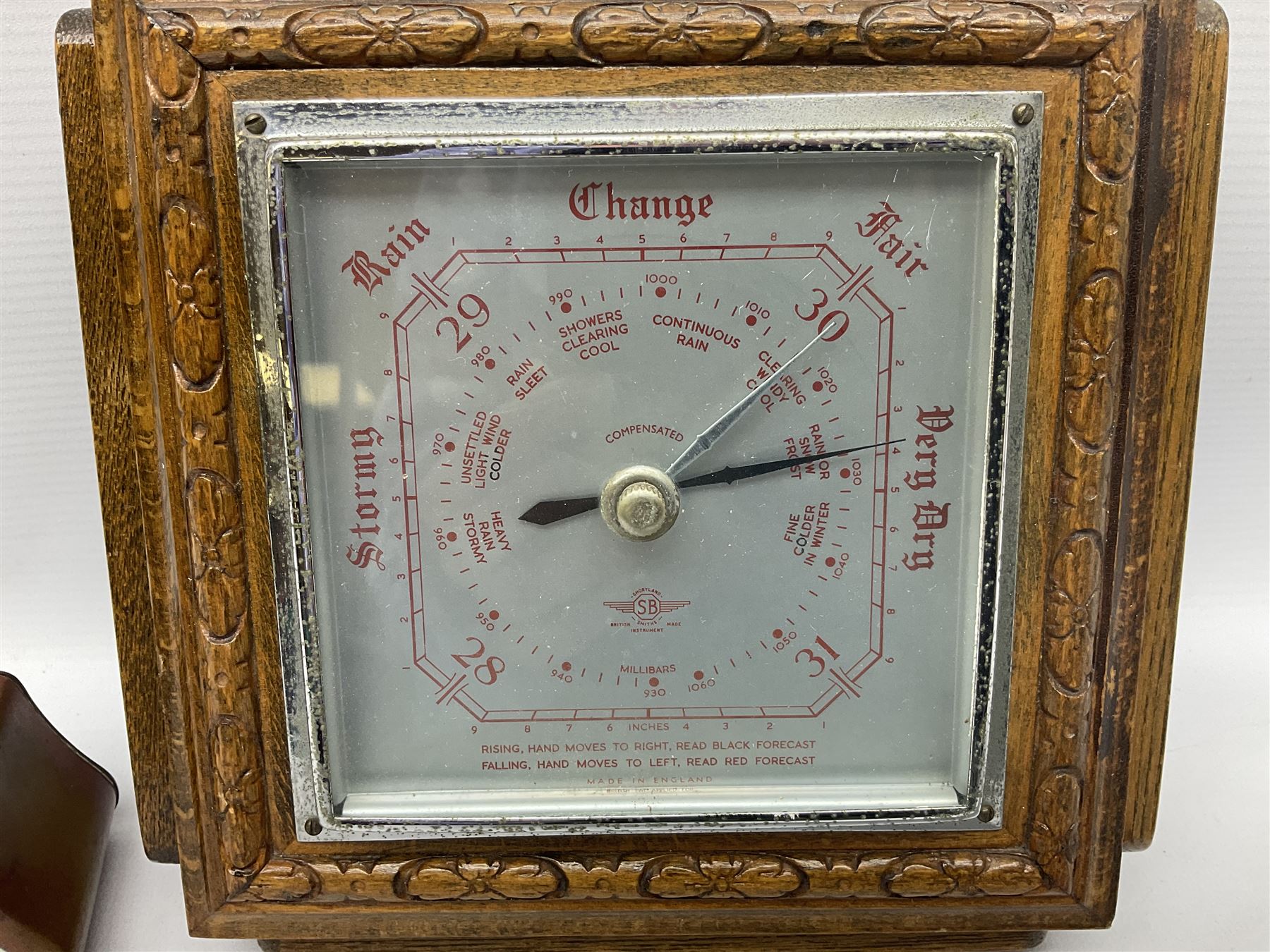 Smiths barometer in carved and stepped oak square case, together with a small copper 8 days clock with bevelled glass plate