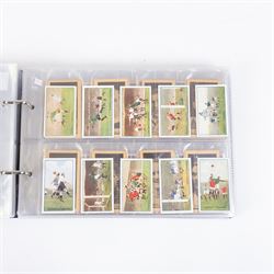 Collection of Edwardian and later Football related trading and cigarette cards, including forty-nine of fifty 1906 Ogden's Football Club Colours, 1922 PALS Footall series, ninety of one hundred 1925 Gallaher Famous Footballers, complete set of forty-four 1926 Ogden's Captains of Association Football Clubs and Colours, complete set of fifty 1927 Players Football Caricatures by MAC,  complete set of fifty 1927 Players Football Caricatures by RIP,  complete set of fifty 1930 Players Association Cup Winners, complete set of 50 1933 Ogdens AFC Nicknames etc, housed in brown cigarette card album