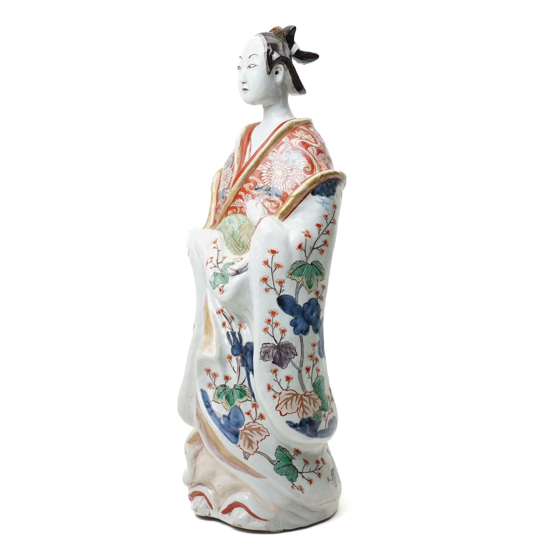 Large Japanese Imari porcelain figure, modelled as a Bijin, wearing a long kimono decorated with apple blossom and leafy branches on a white ground, with gilt detailing, possibly Edo period, H63cm