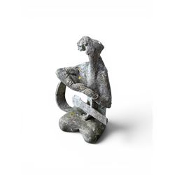 Composite stone sculptured figure playing a guitar, and a shell sculpture (2)