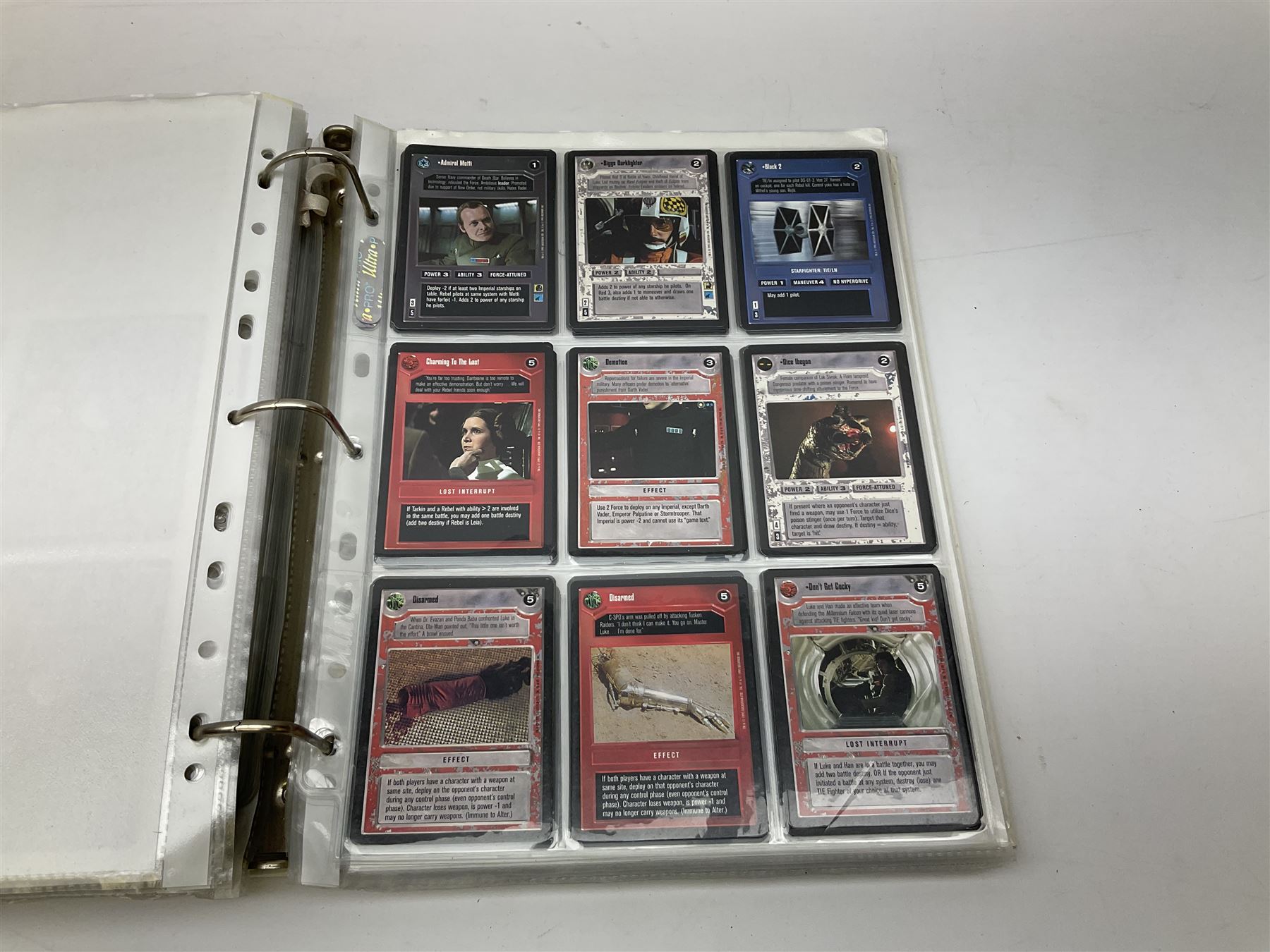 Collection of Star Trek collectors cards to include ‘Alternate Universe’ and ‘Q Continuum’ series, Star Wars cards etc housed in white album
and Harry Potter, Disney and other loose examples