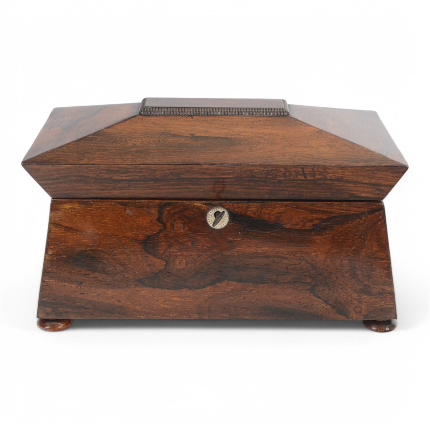 Victorian rosewood tea caddy, of sarcophagus form with mother of pearl escutcheon, upon four squat bun feet, H19cm