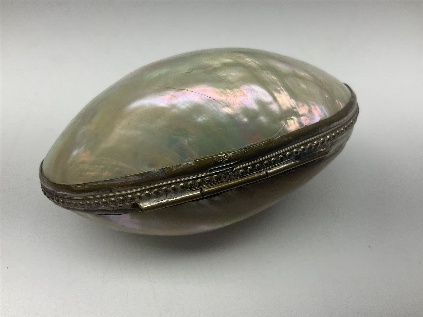 19th century lacquer thimble case with painted portrait of a woman to the hinged lid, together with two mother of pearl egg shaped thimble cases and one other