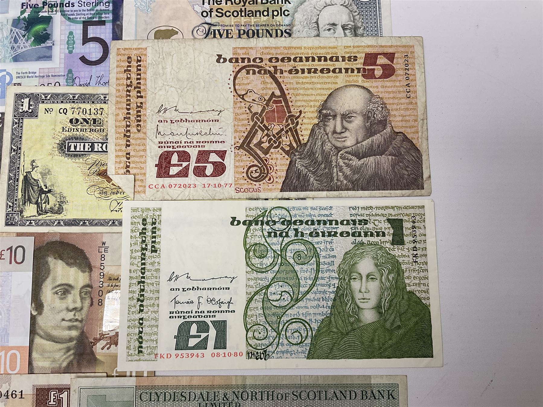 Irish and Scottish banknotes to include Bank of Ireland 5 January 1939 ‘B15’ one pound, two Bank of Scotland 1964 ‘AD07’ and ‘AF05’ one pound notes, one 1966 ‘CQ77’ one pound, and further notes from Clydesdale Bank, National Commercial Bank of Scotland Ltd. etc, housed in plastic sleeves