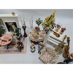 Dolls house furniture, including pianos, fireplace, plants, flower arrangements, tables, chairs, six figures and a collection of instruments and other accessories