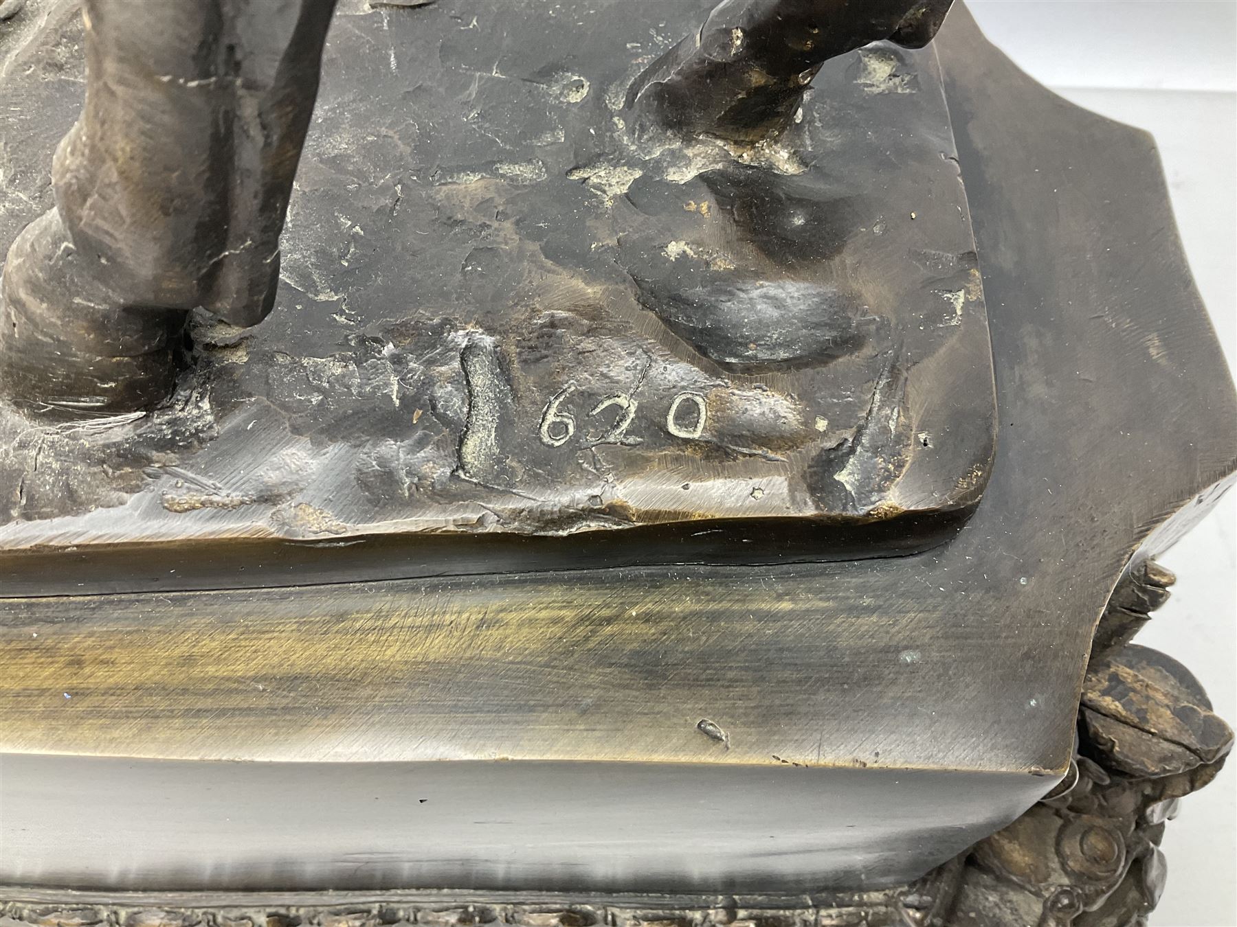 Large and impressive bronze figure of Wellington seated on a horse, on a sarcophogus shaped stepped base impressed 'Meunier Paris', the canted corners inset with battle trophies H68cm L50cm D22cm