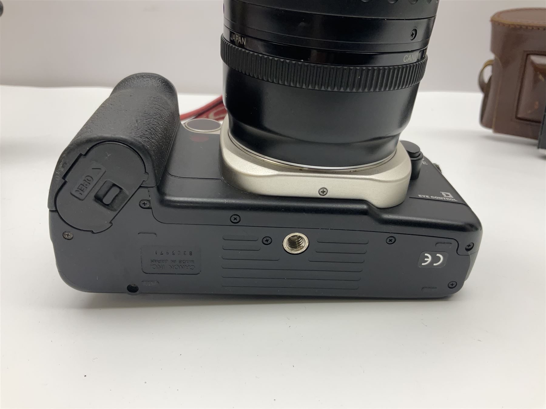 Canon EOS 50e camera body, serial no 8305671 with 'Canon Zoom EF 35-135mm 1:4-5.6' lens together with Halina 35X super camera body, with 'Halina Anastigmat f.c. 1:3.5 f=45mm' lens and other camera equipment 