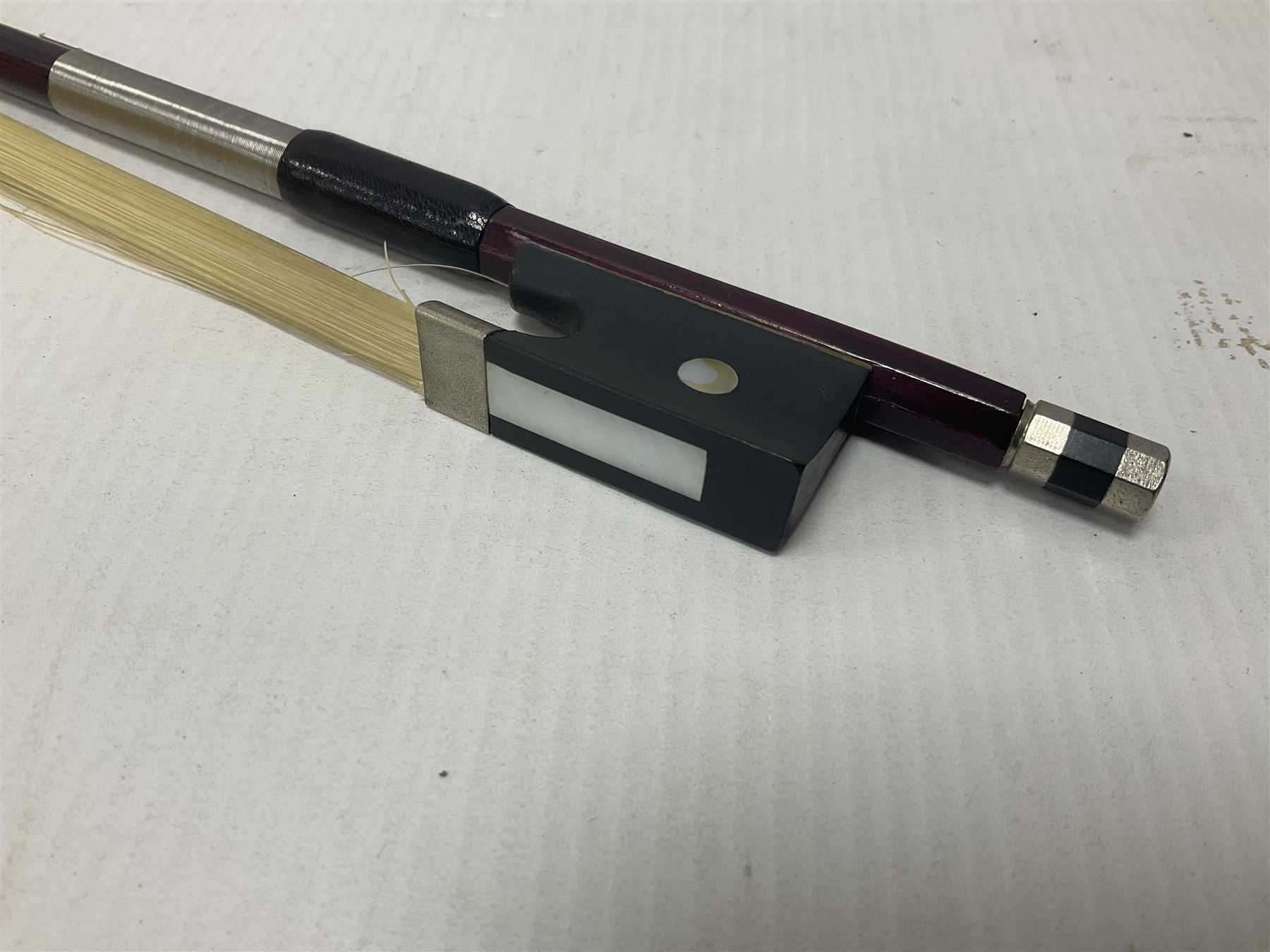 Intermusic 3/4 violin with a violet coloured solid wood body, ebonised fingerboard and fittings, bow and hard case, length 54cm