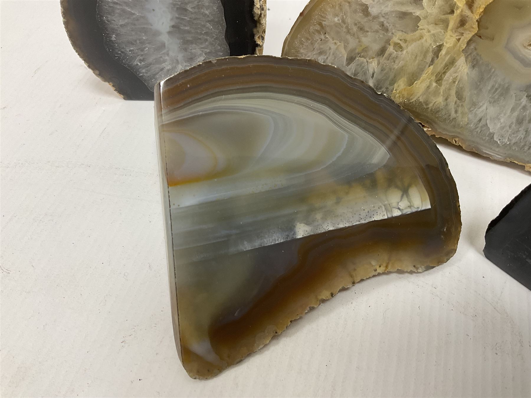 Four polished blue agate geodes, largest H10cm, L18cm