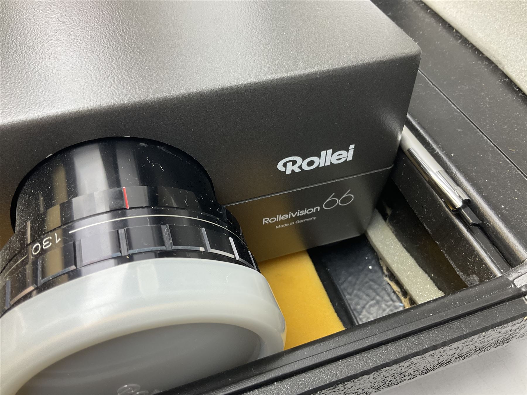 Cased Rollei projector together with a palar projector screen, autofocus slide projector and cenei scoper 360 