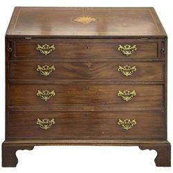 George III mahogany bureau, the conch inlaid fall front enclosing pigeon holes, shelves and central cupboard with inlaid flower motif, four graduating cock-beaded drawers below each with brass handles, lower moulded edge over shaped bracket feet