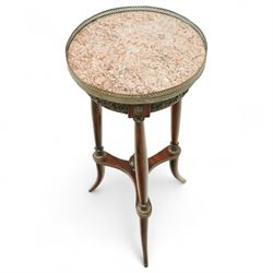 Late 19th century French Empire style mahogany and gilt metal mounted jardinière stand, circular rouge marble top with pierced brass gallery, on three turned supports joined by an undertier stretcher and splayed legs