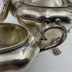 Five piece Edwardian silver tea service, comprising teapot and coffee pot, each with ebonised scroll handle, tea caddy with hinged cover, twin handled open sucrier, and milk jug, each of rounded bombe form, upon four paw feet, hallmarked William Adams Ltd, Birmingham 1904 and 1905, coffee pot H26cm

