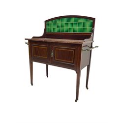 Edwardian inlaid mahogany washstand, raised back with emerald green tiles over marble top, fitted with two panelled cupboard doors, raised on square tapering supports on ceramic castors