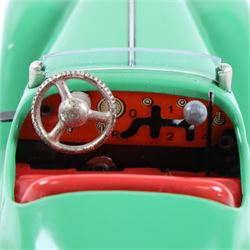 Schuco Examico 4001 tinplate clockwork car, in green with red interior, with key