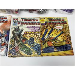 Four 1980sTransformer G1 - Optimus Prime 1984; DinoBot Sludge (Diplodocus) 1984; Cyclonus 1986; and Runamuck 1986; with paperwork; seven Bandai Robo Machines Robots/Transformers; almost fully stocked Panini Sticker album; two annuals; three comics; two posters; and Ladybird story book