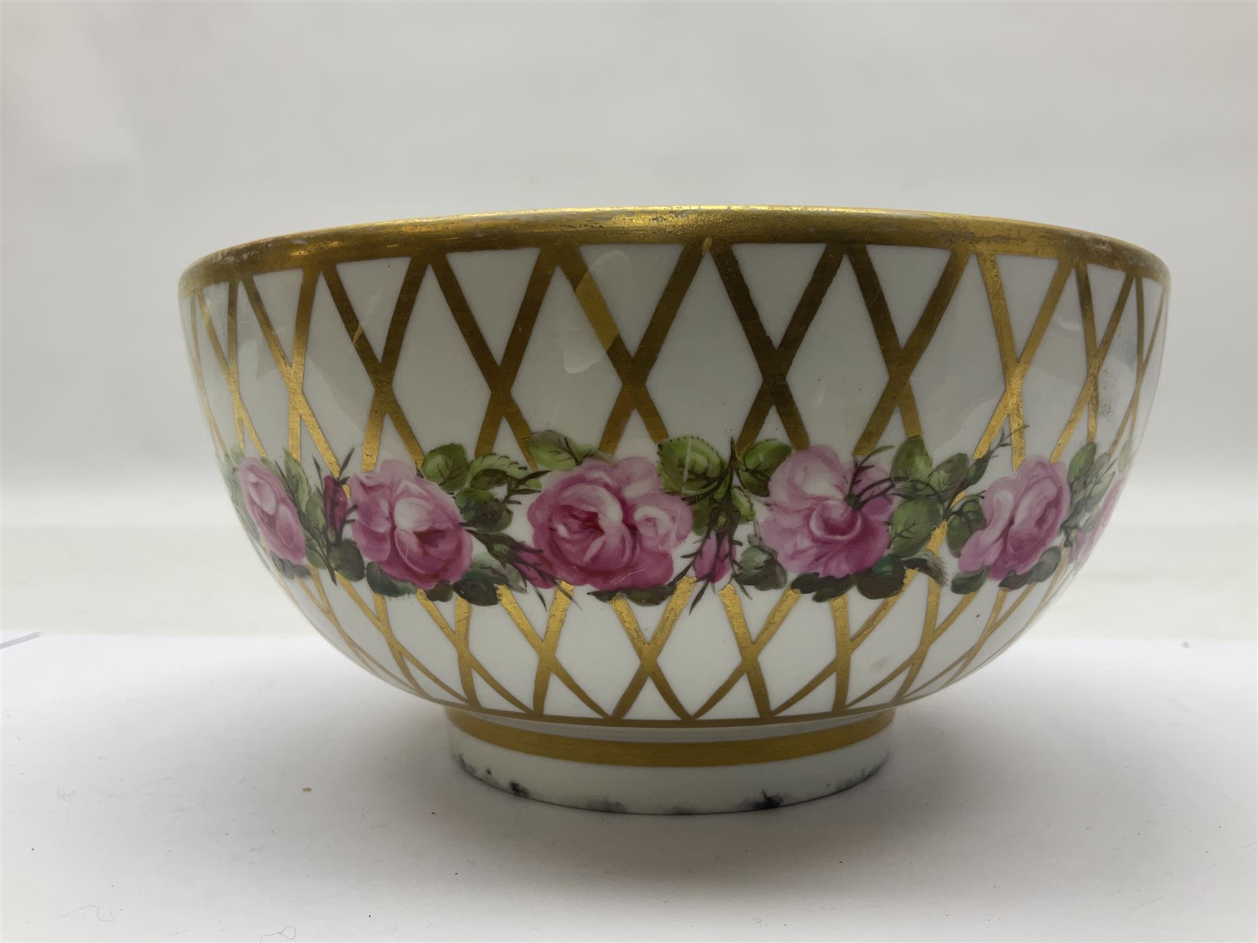 Group of 18th and 19th century ceramics for repair and restoration, to include an 18th century Derby figure emblematic of the Continent of Africa, pair of small 19th century Derby vases, painted with birds and floral spray, 19th century Derby slop bowl decorated in the 594 pattern with pink roses against gilt trellis, 19th century Derby figure of a recumbent deer, Serves style box, and two further figures