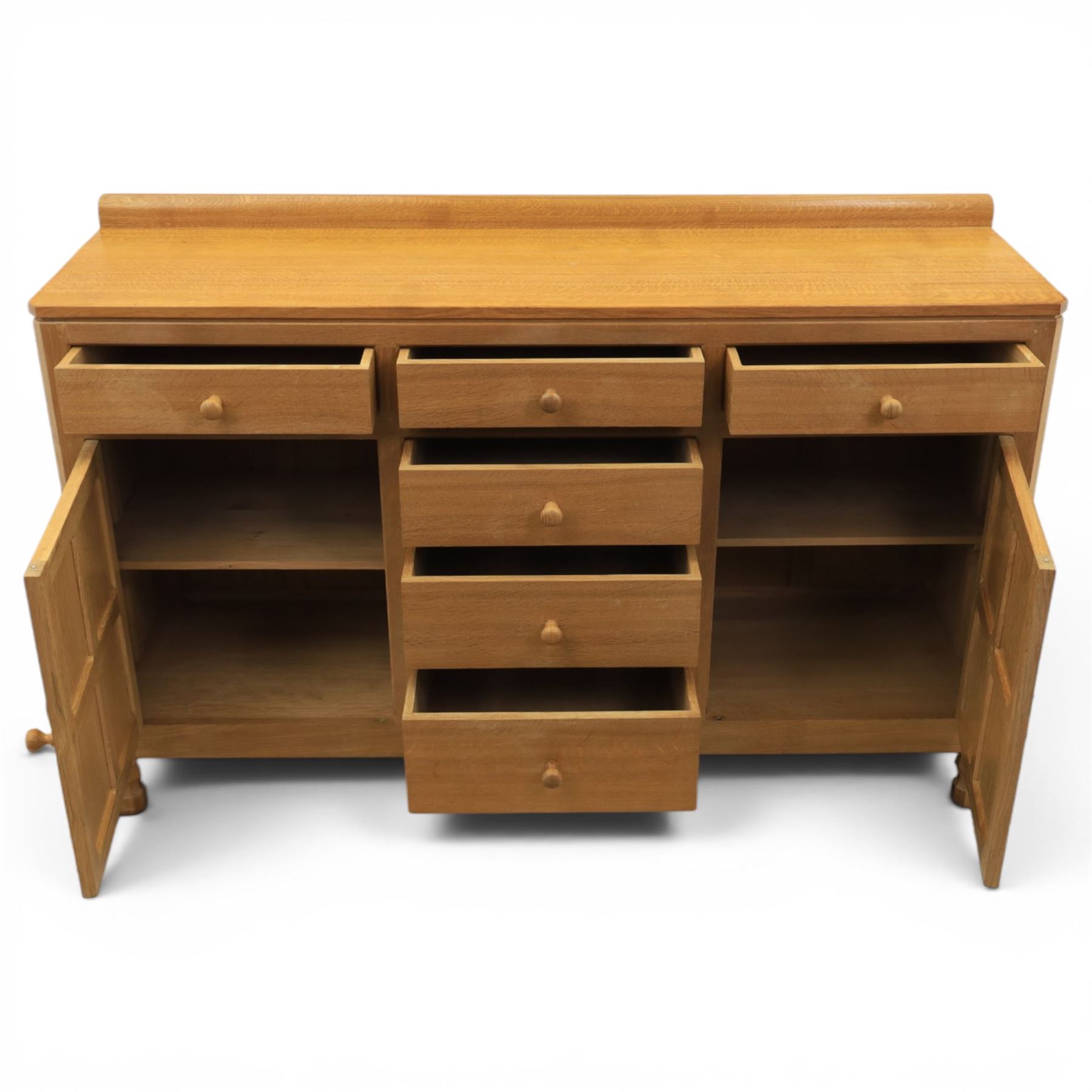 Mouseman - adzed oak dresser, fitted with six drawer and two cupboards, with carved mouse signature, by the workshop of Robert Thompson of Kilburn