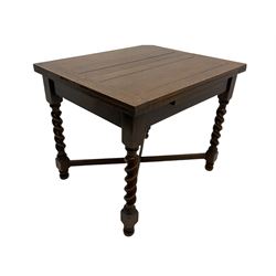 Early 20th century oak barley twist extending table, two fold-over leaves with pull-out stays, spiral turned supports joined by x-stretchers