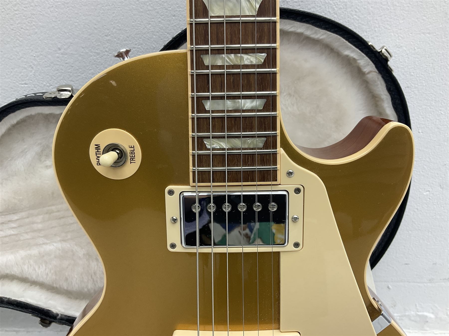 2011 Gibson Les Paul Traditional gold top electric guitar; serial number 103110461; with  mahogany back, twenty-two frets, 57 Classic humbuckers and bridge/stop bar tailpiece L100cm; in Gibson hardcase with owners manual and associated paperwork