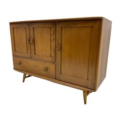 Ercol - elm and beech sideboard, fitted with cupboards and single drawer, enclosed by panelled doors, on splayed tapering feet