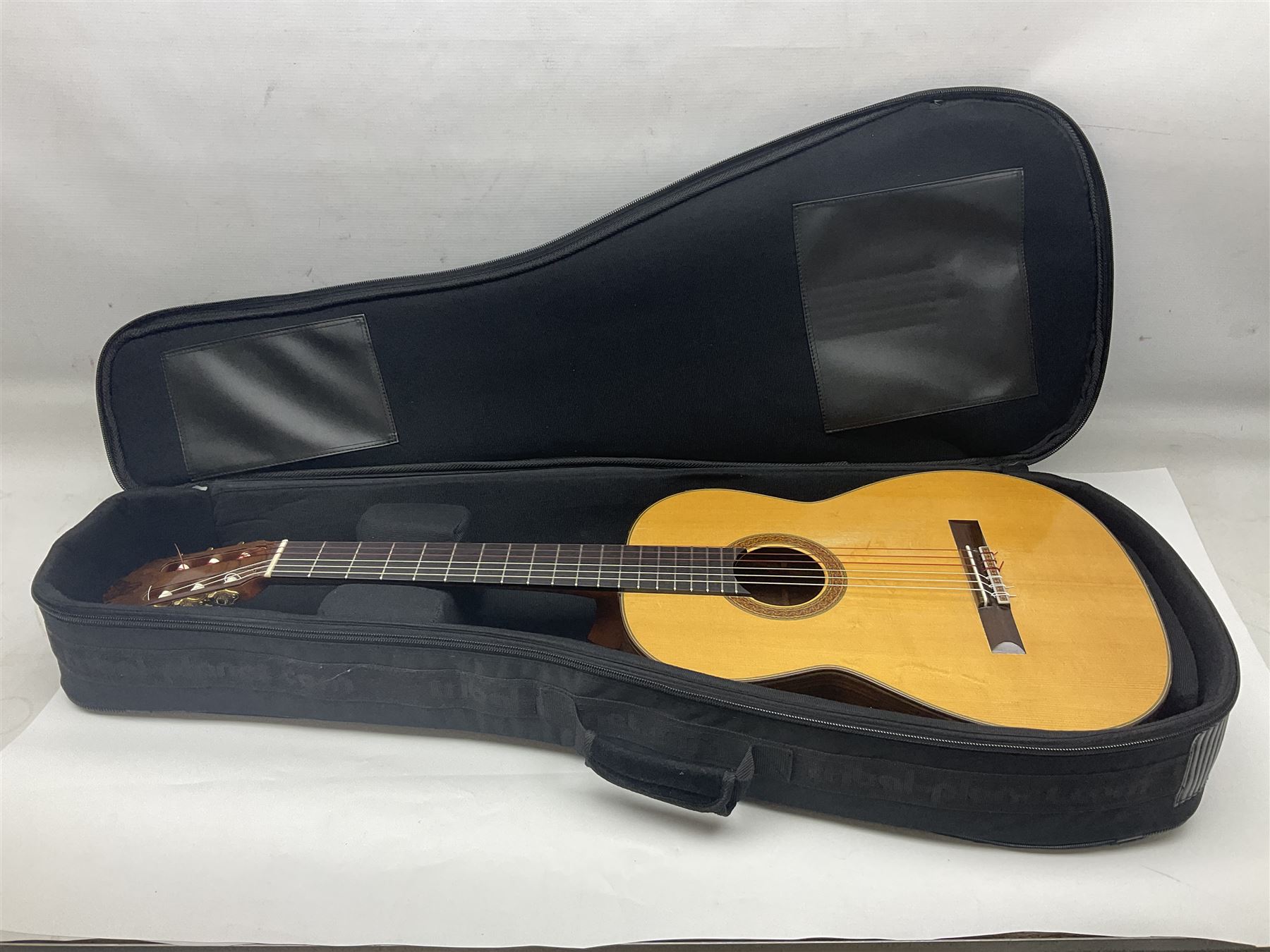 British hand made classical acoustic guitar by Huw Morgan with Indian rosewood back and sides and spruce top; bears label dated May 1998; L100cm; in Tribal Planet lightweight carrying case