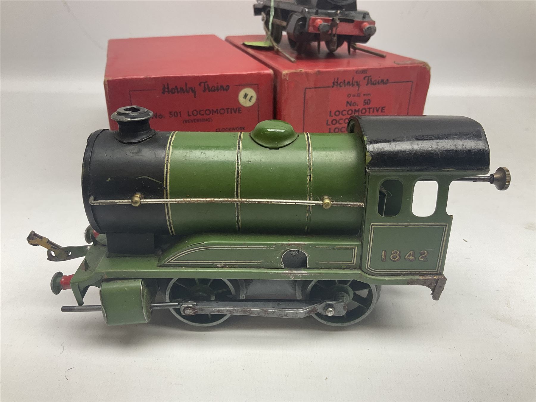 Hornby '0' gauge - No.501 clockwork 0-4-0 locomotive No.1842; boxed; No.501 Tender; boxed; No.101 clockwork 0-4-0 locomotive No.2270; and No.50 clockwork 0-4-0 locomotive No.60199 for spares or repair; boxed (4)