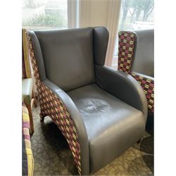 Two curved wing back armchairs, upholstered in charcoal and stripe patterned fabric, with stool (3)- LOT SUBJECT TO VAT ON THE HAMMER PRICE - To be collected by appointment from The Ambassador Hotel, 36-38 Esplanade, Scarborough YO11 2AY. ALL GOODS MUST BE REMOVED BY WEDNESDAY 15TH JUNE.